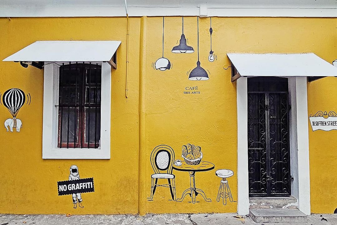 The cheerful yellow facade draws you in